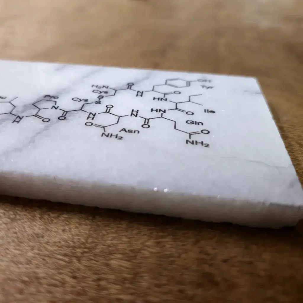 Oxytocin structure engraved on marble tile